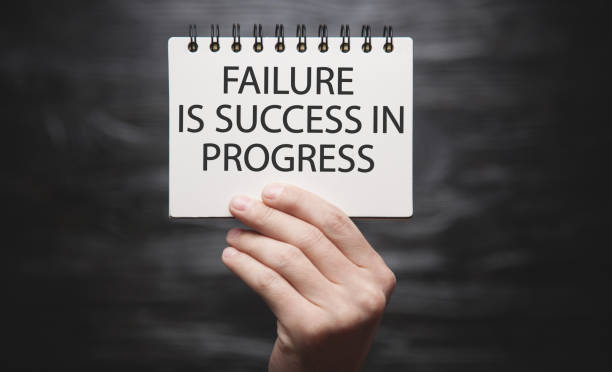 istock Male hand showing Failure Is Success In Progress text. 1367384773