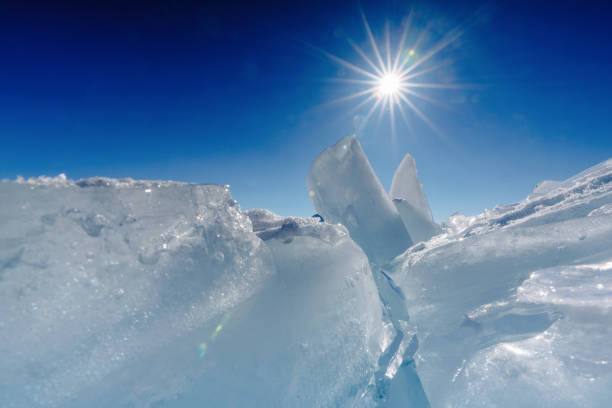 Whimsical forms of frozen water and cloudless sky Lake Baikal