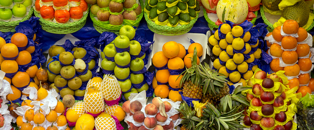 Heaps of colorful fruits, on Municipal market of Sao Paulo city, Brazil