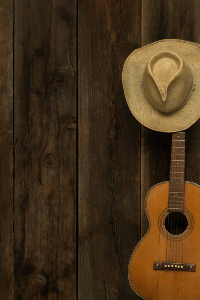 istock Barn wood background with guitar and cowboy hat 1367385074