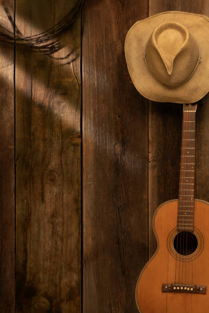 istock Barn wood background with guitar and cowboy hat 1367385080