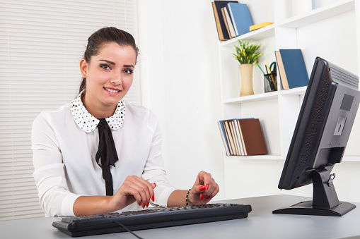 Young businesswoman working with computer