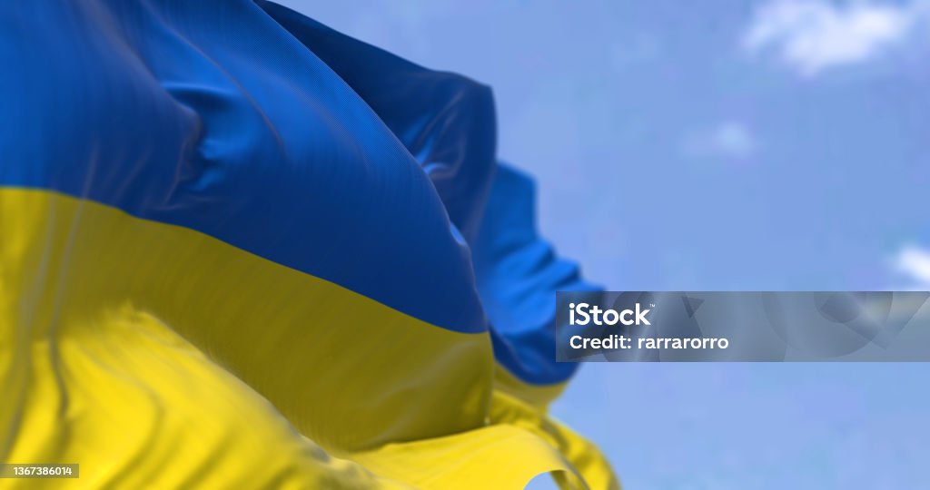 Detail of the national flag of Ukraine waving in the wind on a clear day Detail of the national flag of Ukraine waving in the wind on a clear day. Democracy and politics. Eastern Europe country. Patriotism. Selective focus. Ukraine Stock Photo