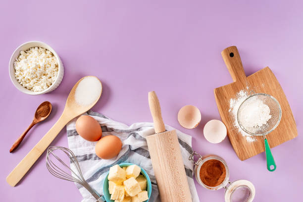 istock Various products and ingredients for baking at home on a purple background. Copy space, top view. 1367386371