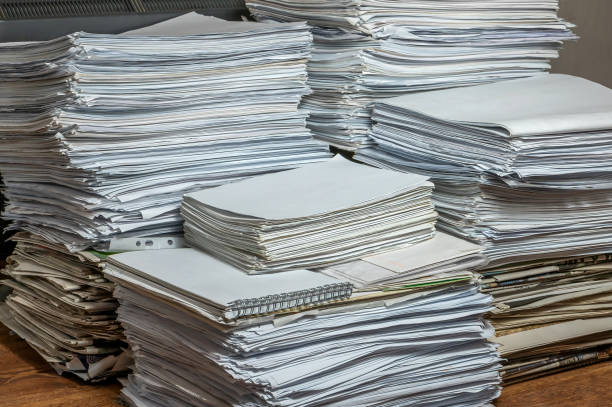 pile of paper documents in the office, paper trash, waste paper stock photo