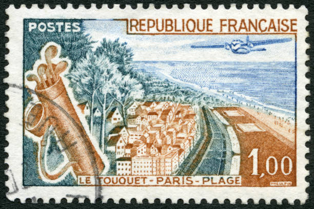 Postage stamp issued in  France in 1955 shows a  view across the river of  the town of Uzerche.