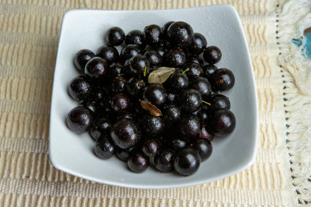 istock Still life with portion of jaboticaba, Brazilian grape, in white platter 1367389216