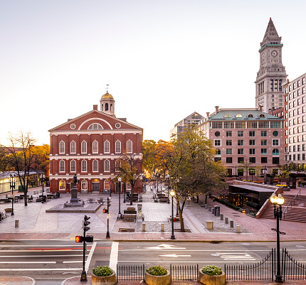 View of Boston in Massachusetts, USA showcasing its mix of modern and historic architecture at Quincy Market and Faneuil Hall.