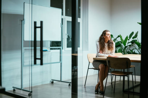 istock Businesswoman working late in the office. 1367390491