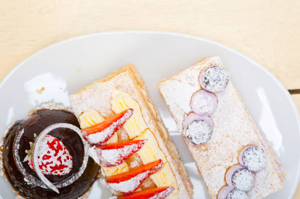 istock selection of fresh cream cake dessert plate 1367391429