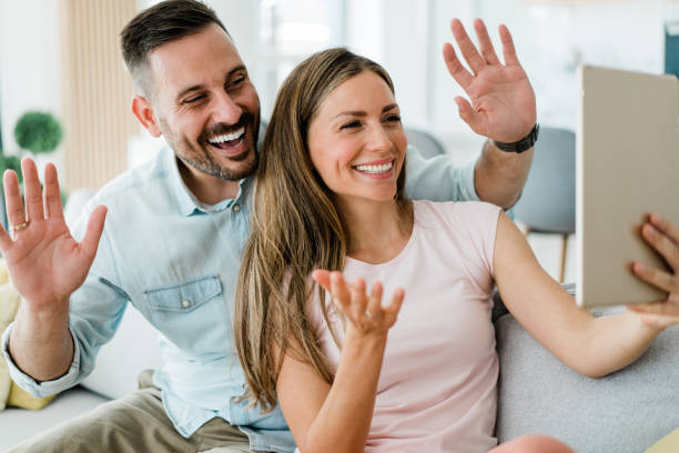 istock Couple making video call at home. 1367391499
