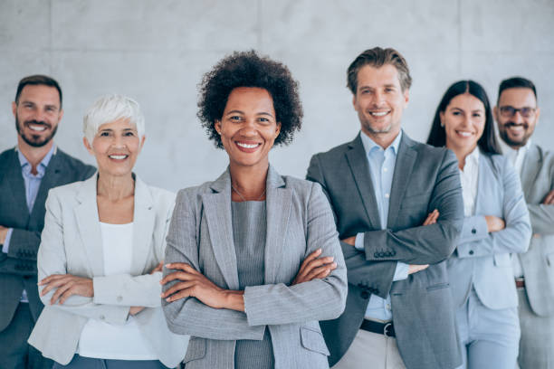 istock Confident businesswoman and her team. 1367391831