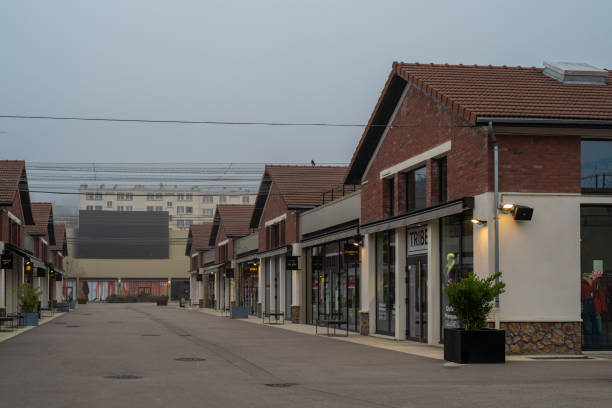 Romainville cityscape Romainville, France - January 13 2022: Paddock Paris EST Factory Outlet village near Paris on a foggy winter morning. reebok stock pictures, royalty-free photos & images