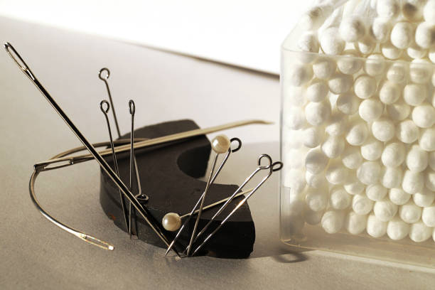 Needle cushion. A seamstress workplace. Textile factory sewing workshop. Furniture manufacture. Horizontal orientation.