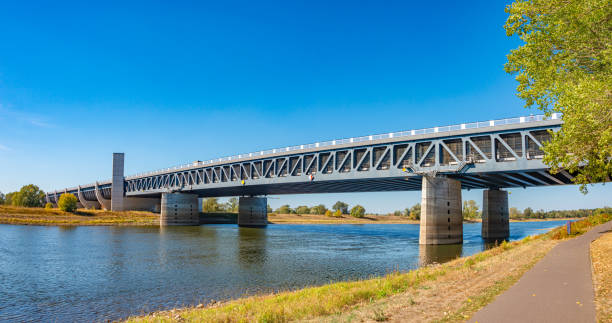 Panoramic view over a famous wonder water bridge for ship navigation canal near Magdeburg at Autumn colors, sunny day and blue sky, Magdeburg, Germany.