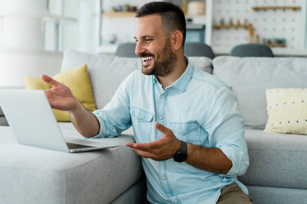 istock Man having video call at home. 1367394213