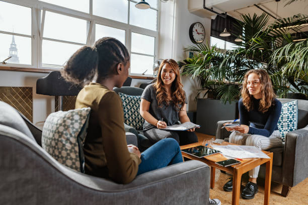 istock Three casual businesswomen or entrepreneurs talking about new project 1367395254