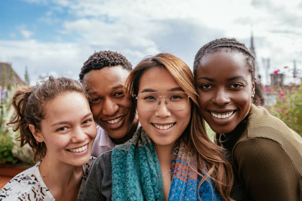 istock Group of diverse students together looking at camera 1367395323