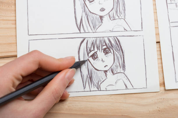 istock Artist drawing an anime comic book in a studio. 1367395564
