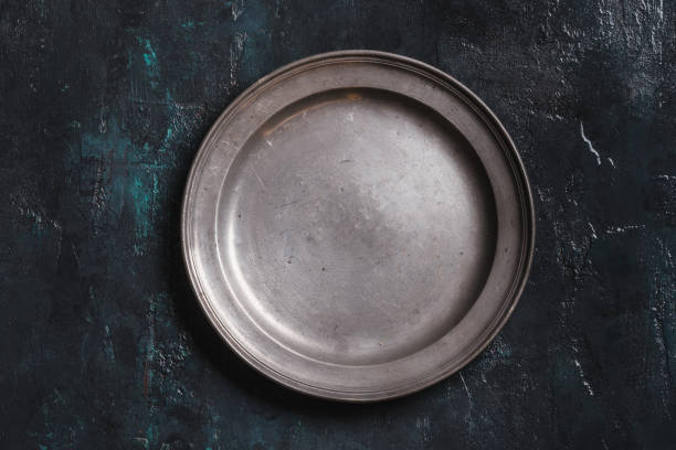 istock Old vintage empty plate on dark background top view copy space. 1367395870
