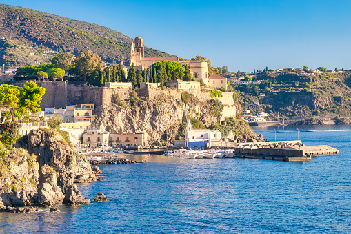 Lipari with the port marina Corta and the castle complex from the 16th century with the Cathedral of San Bartolomeo and the Chiesa delle Anime del Purgatorio in Sicily in Italy