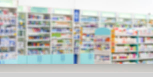 istock Pharmacy table banner background. Blur counters of pharmacy with medicines, tablets and pills. 1367398446