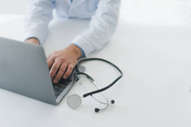 istock Doctor typing on laptop 1367398498