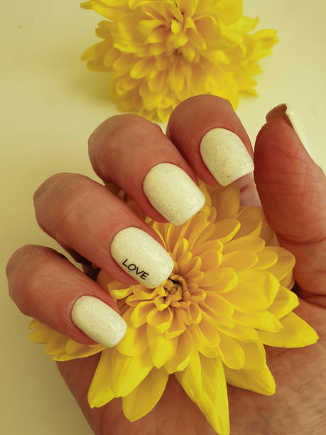 istock female hand beautiful manicure flower 1367398512