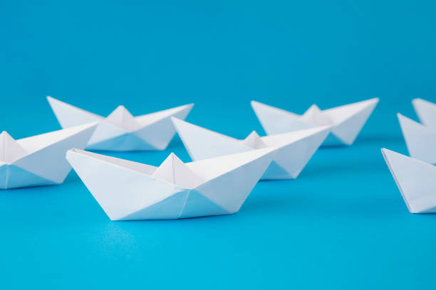 istock White Paper Boat Leading Other Boats 1367399986