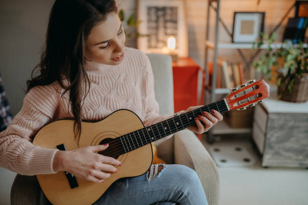 istock Female vlogger recording music related broadcast at home 1367400022