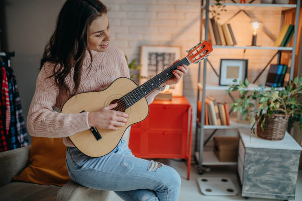 istock Female vlogger recording music related broadcast at home 1367400042
