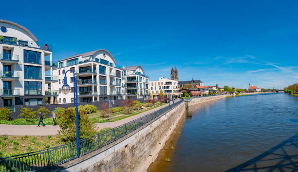 istock Panoramic view over modern houses at Elbe river in early Spring in Magdeburg, Germany, at blue sky and sunny day 1367400234