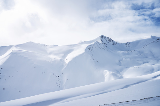 Beautiful landscape winter summer day on snowy mountain in ski resort Arkhyz, Caucasus mountains, Russia.
