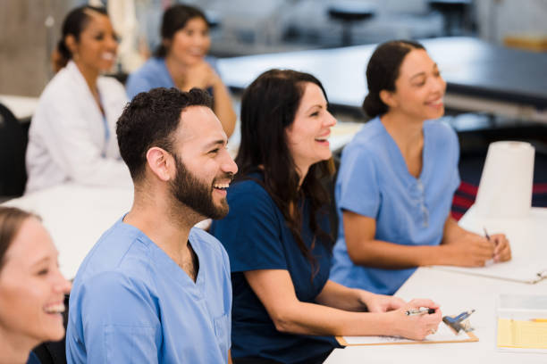 istock Diverse interns enjoy lecture by unseen person 1367402235