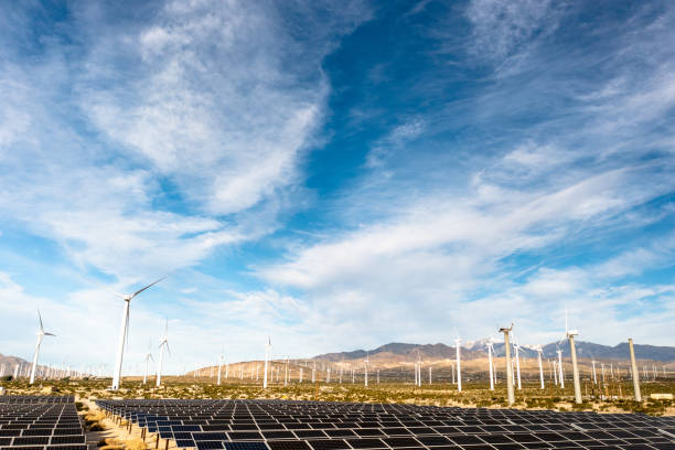 istock Aerial View over Solar Panels and Windmills 1367402305