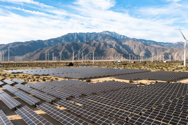 istock Aerial View over Solar Panels and Windmills 1367402348