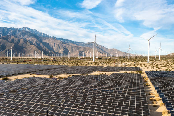 istock Aerial View over Solar Panels and Windmills 1367402383
