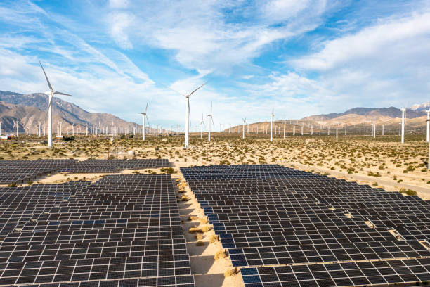istock Aerial View over Solar Panels and Windmills 1367402390