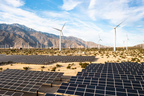 istock Aerial View over Solar Panels and Windmills 1367402534