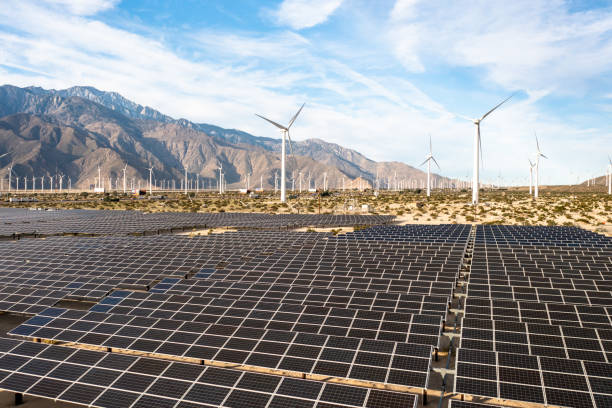 istock Aerial View over Solar Panels and Windmills 1367402537