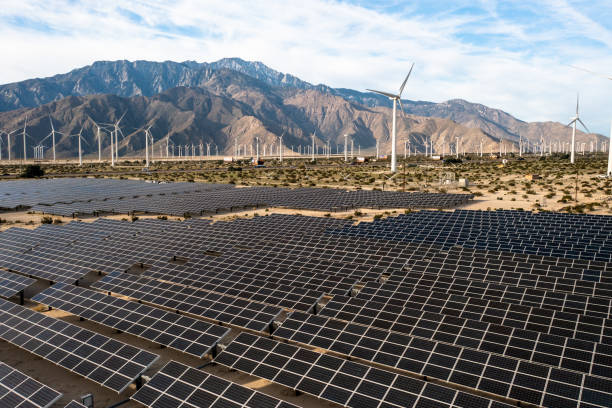 istock Aerial View over Solar Panels and Windmills 1367402566
