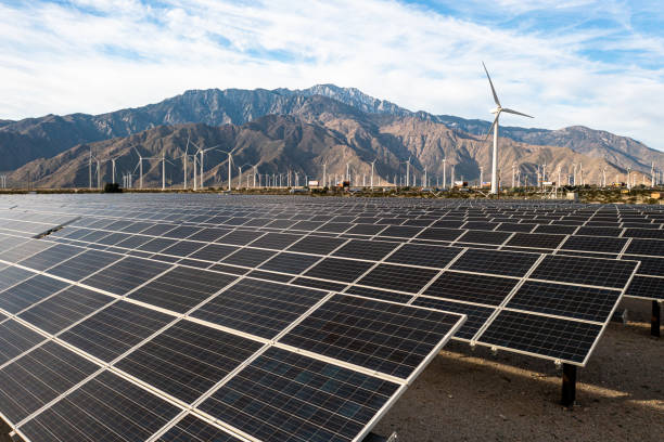istock Aerial View over Solar Panels and Windmills 1367402579