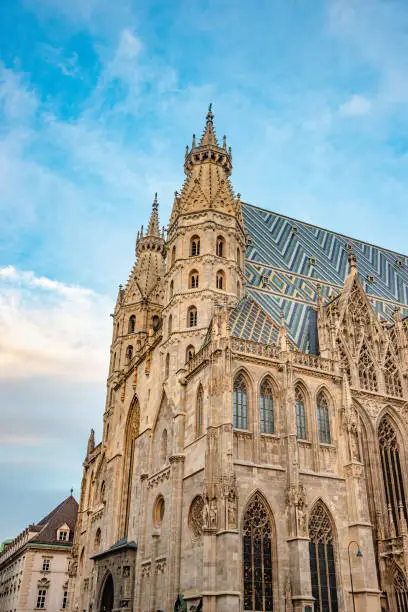 Famous iconic Stephan Cathedral at sunset colors and blue sky in historical touristic downtown of Vienna, Austria