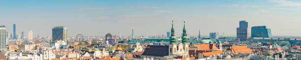 istock Panoramic bird view over warm sunset in in historical touristic downtown with many old and modern buildings, Vienna, Austria. 1367404045