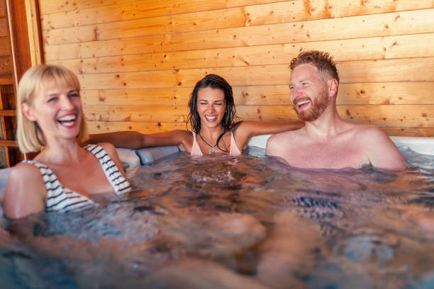 istock Friends relaxing and having fun in hot tub 1367404089