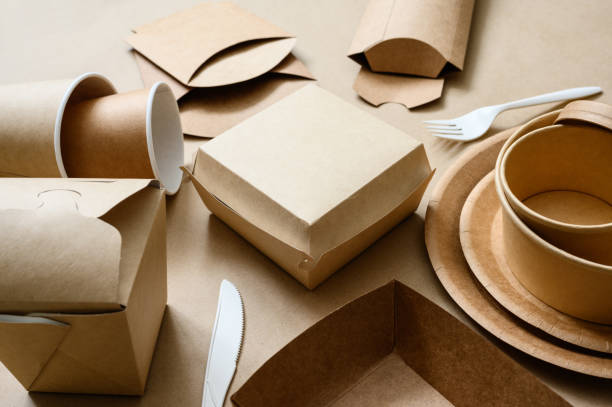 istock Disposable biodegradable tableware made of cardboard and paper. Ecology concept. Selective focus in the center of the frame. 1367404936