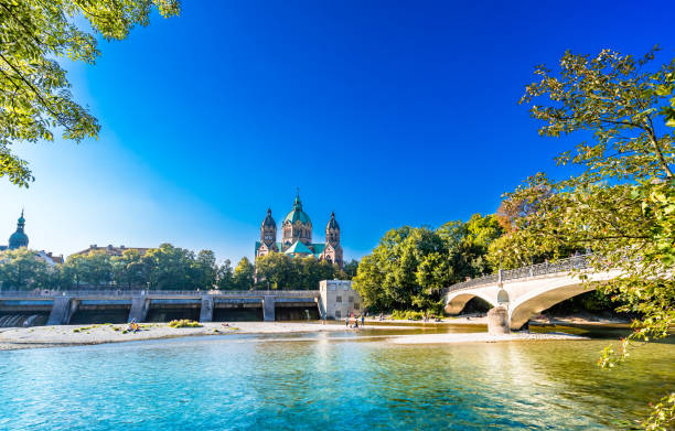 St. Luke's Church Lukaskirche - and isar river in summer landscape of Munich, Bavaria, Germany stock photo