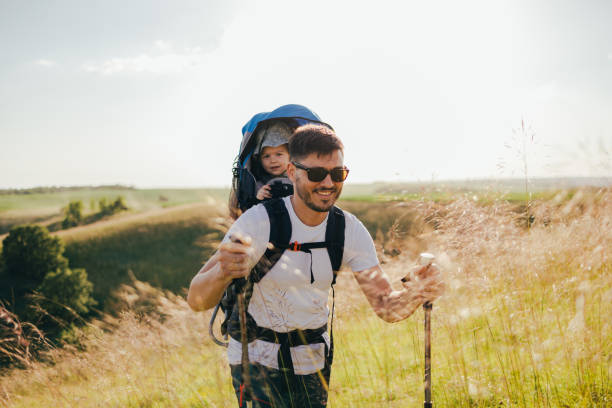 istock Happy Dad Hiking with Daughter on a Sunny Summer Day 1367408433