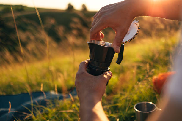 istock Close Up Shot of Anonymous Man Setting up Mocha Coffee Maker 1367408524