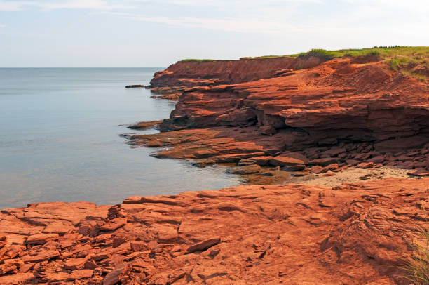 Red Sandstone Cliffs at Low Tide stock photo